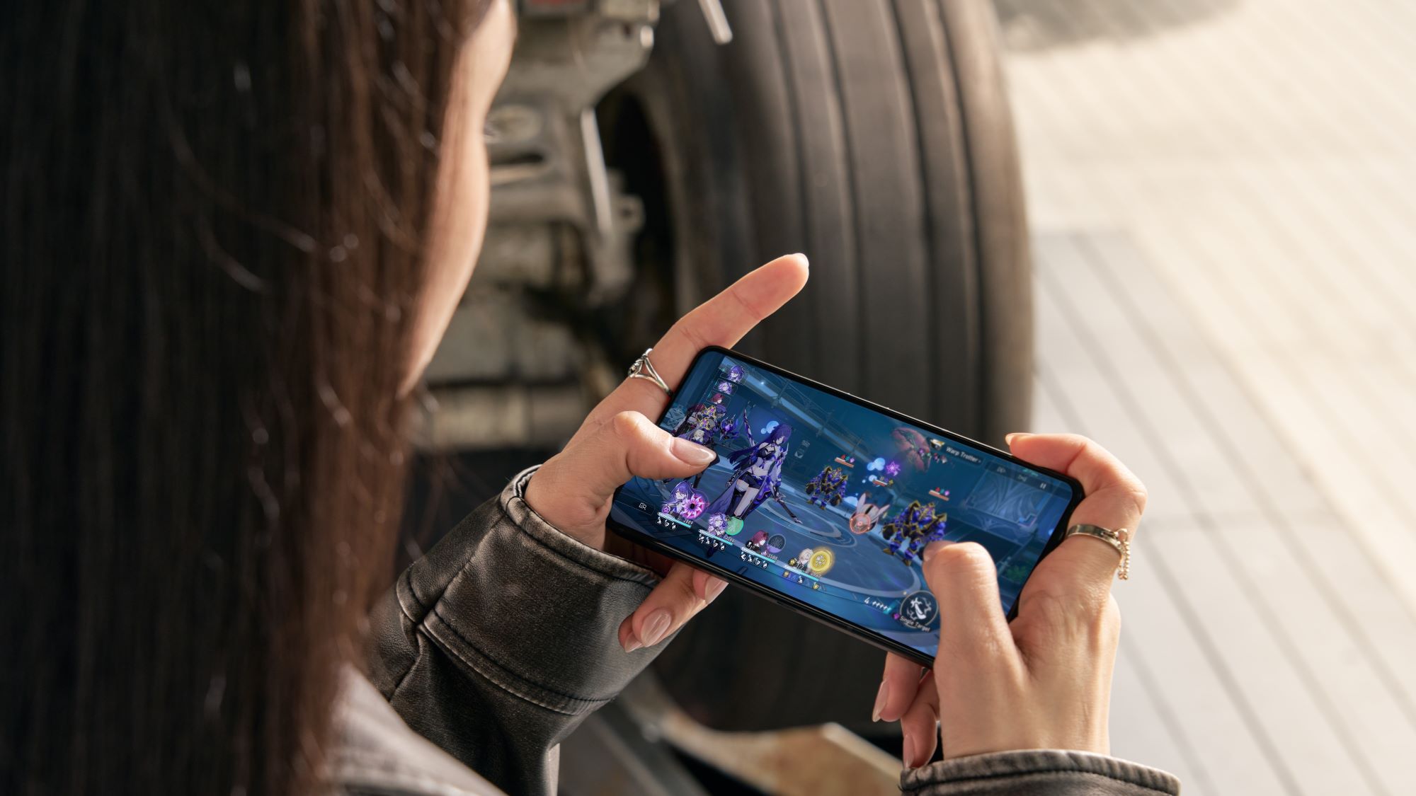 Mobile gaming demonstration shown on a smartphone screen during a technology showcase